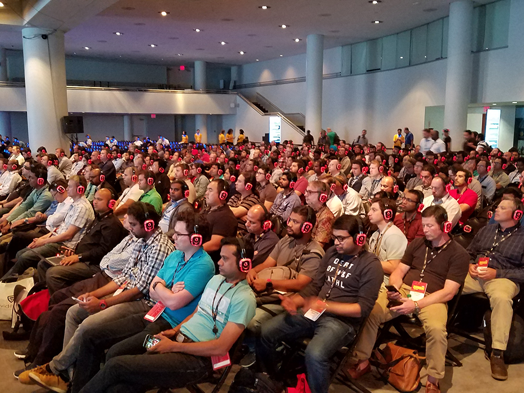 On a conference everyone is in Red Headphones