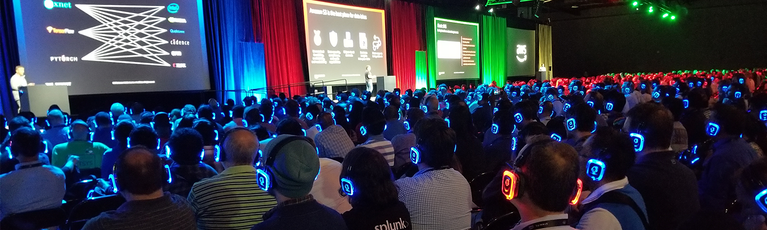 group of people watching a conference with headphones on