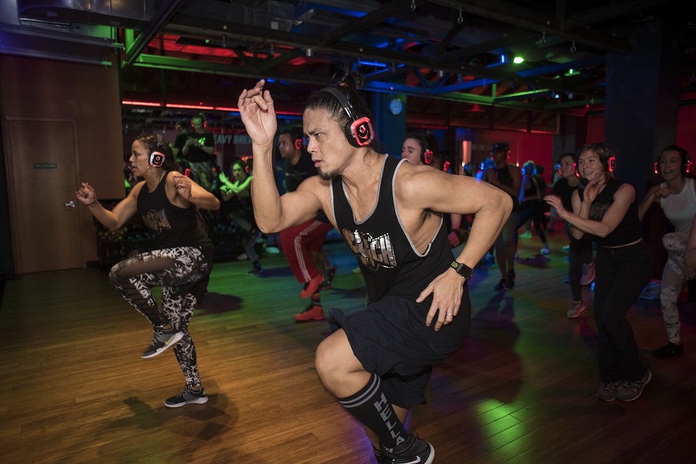 Fitness class with headphones male