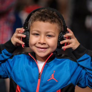Small child wearing headphones